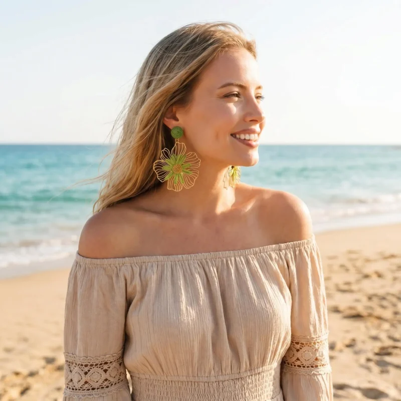 Women wearing green gold raffia floral earrings on beach vacation, boho summer jewelry